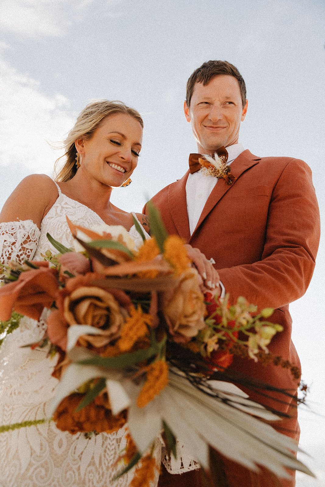 beautiful bride and groom pose together after their dreamy elopement