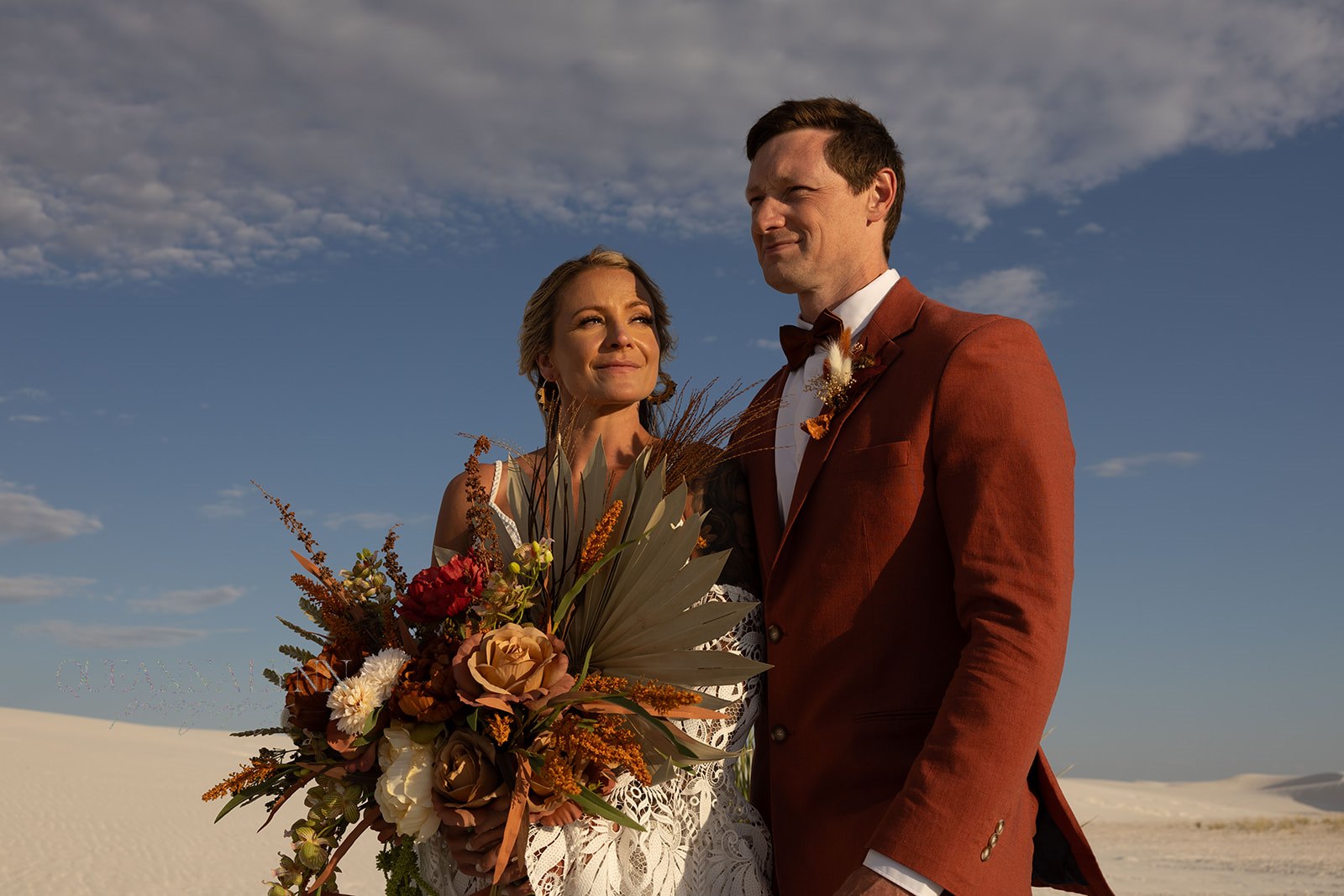 beautiful bride and groom pose together after their dreamy elopement