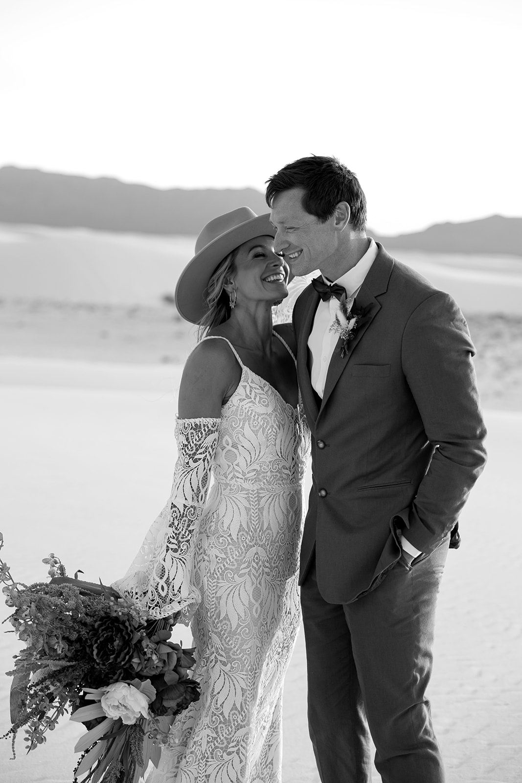 beautiful bride and groom pose together after their dreamy elopement