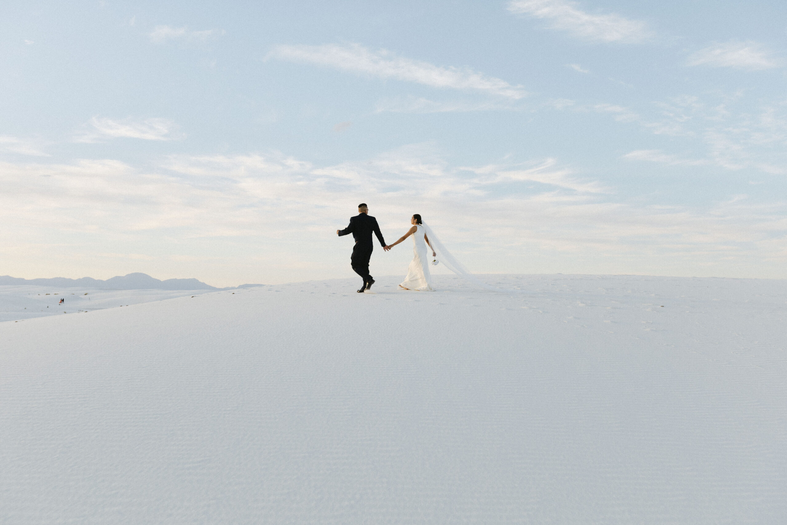 beautiful bride and groom pose together after their dreamy elopement