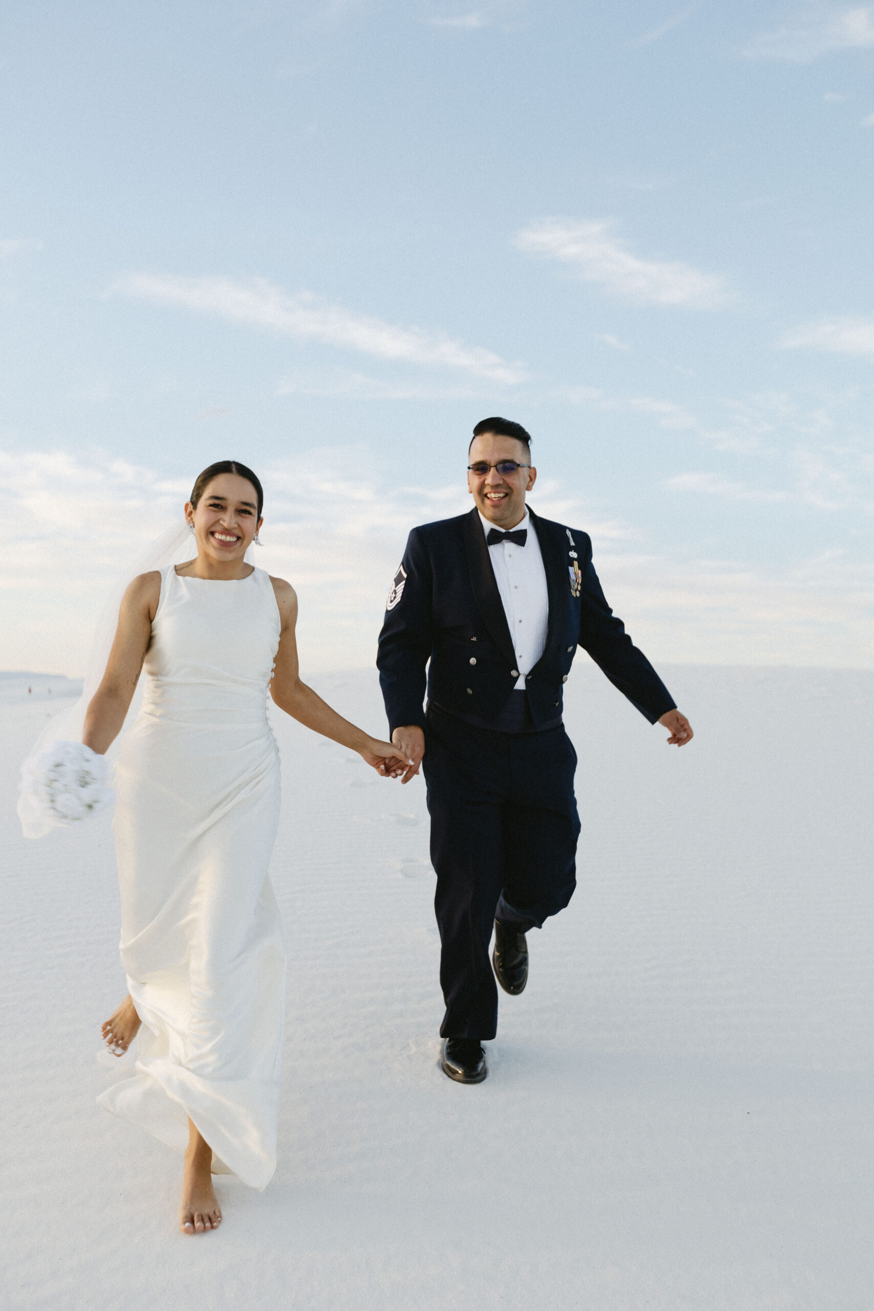 beautiful bride and groom pose together after their dreamy elopement