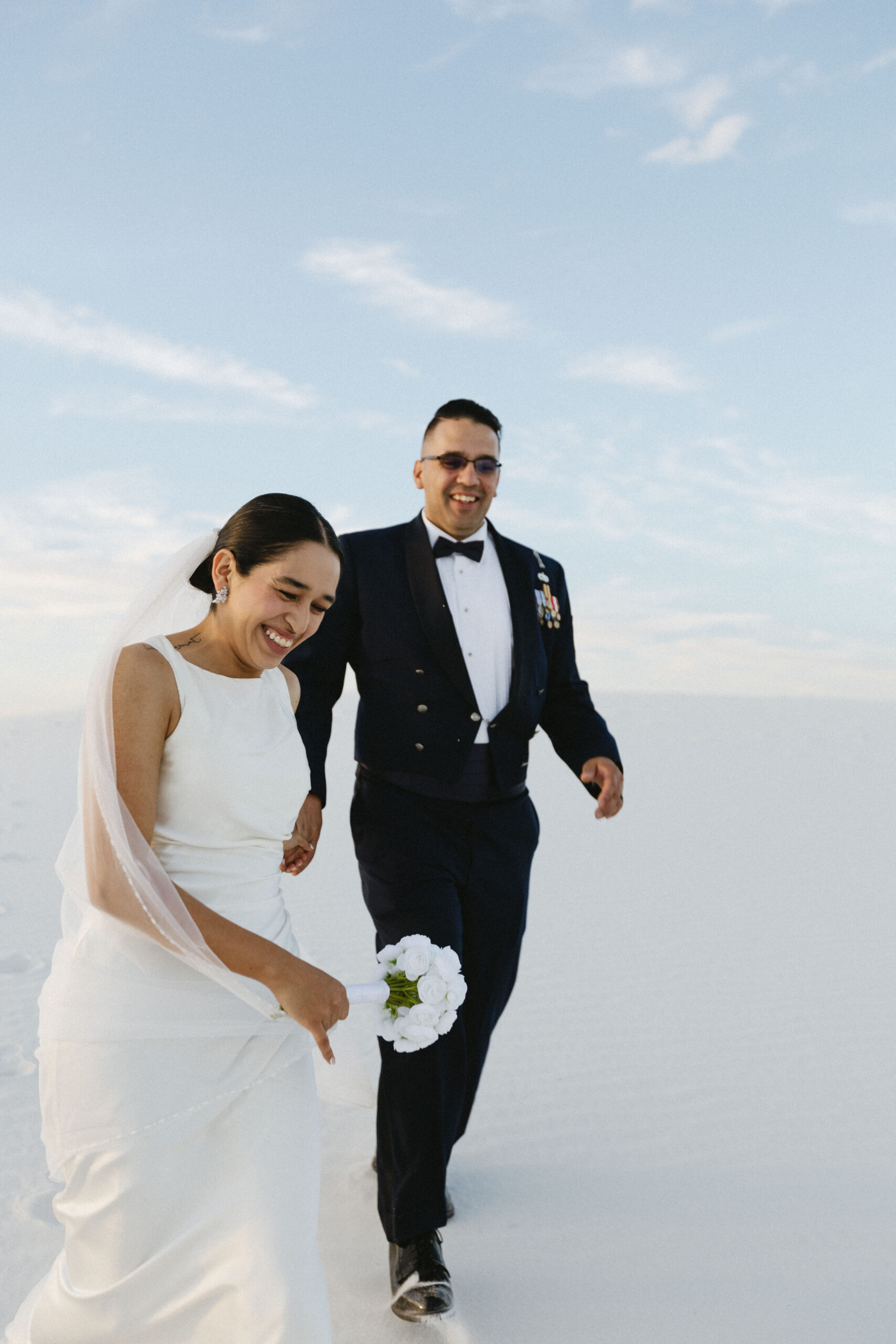 beautiful bride and groom pose together after their dreamy elopement