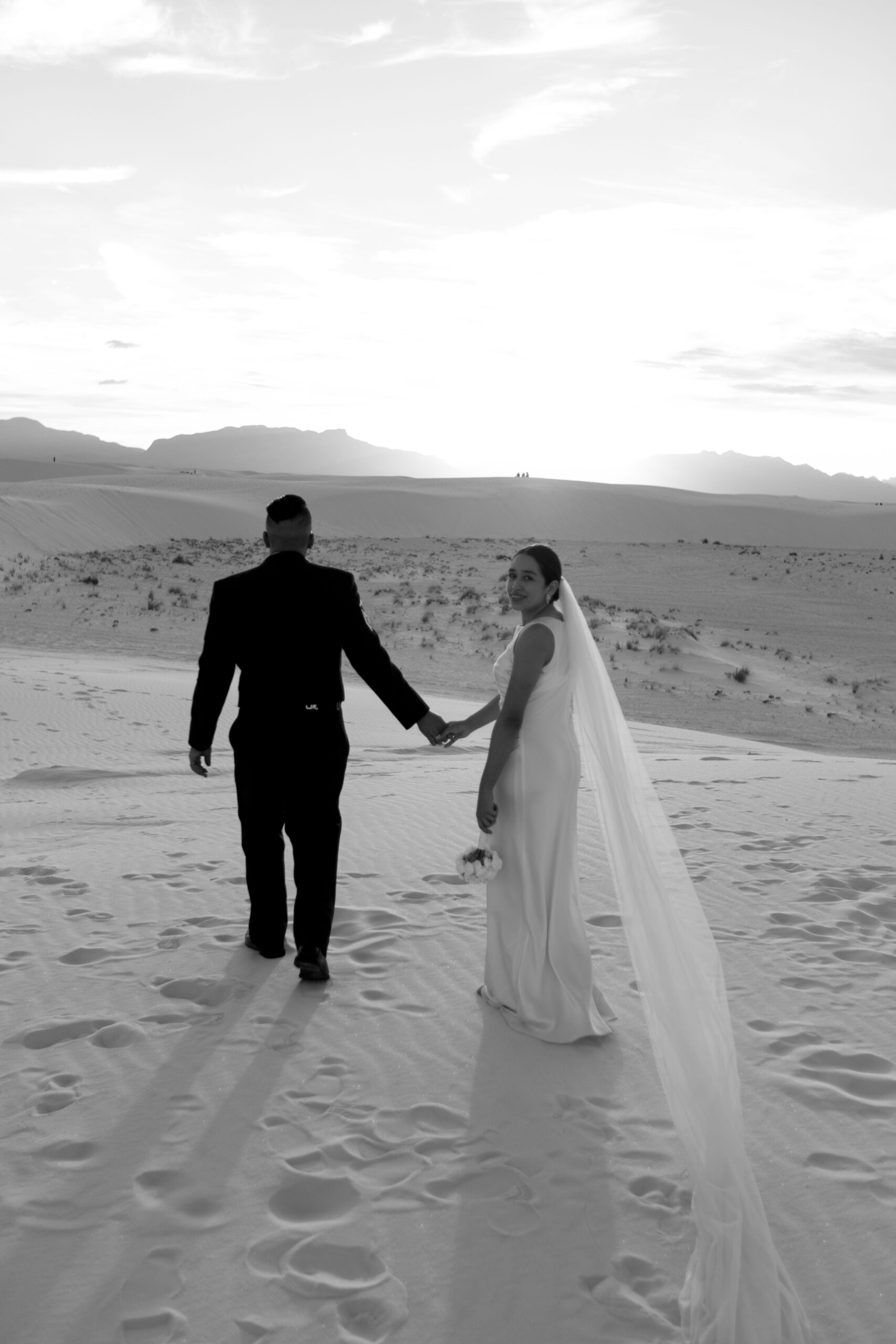 beautiful bride and groom pose together after their dreamy elopement