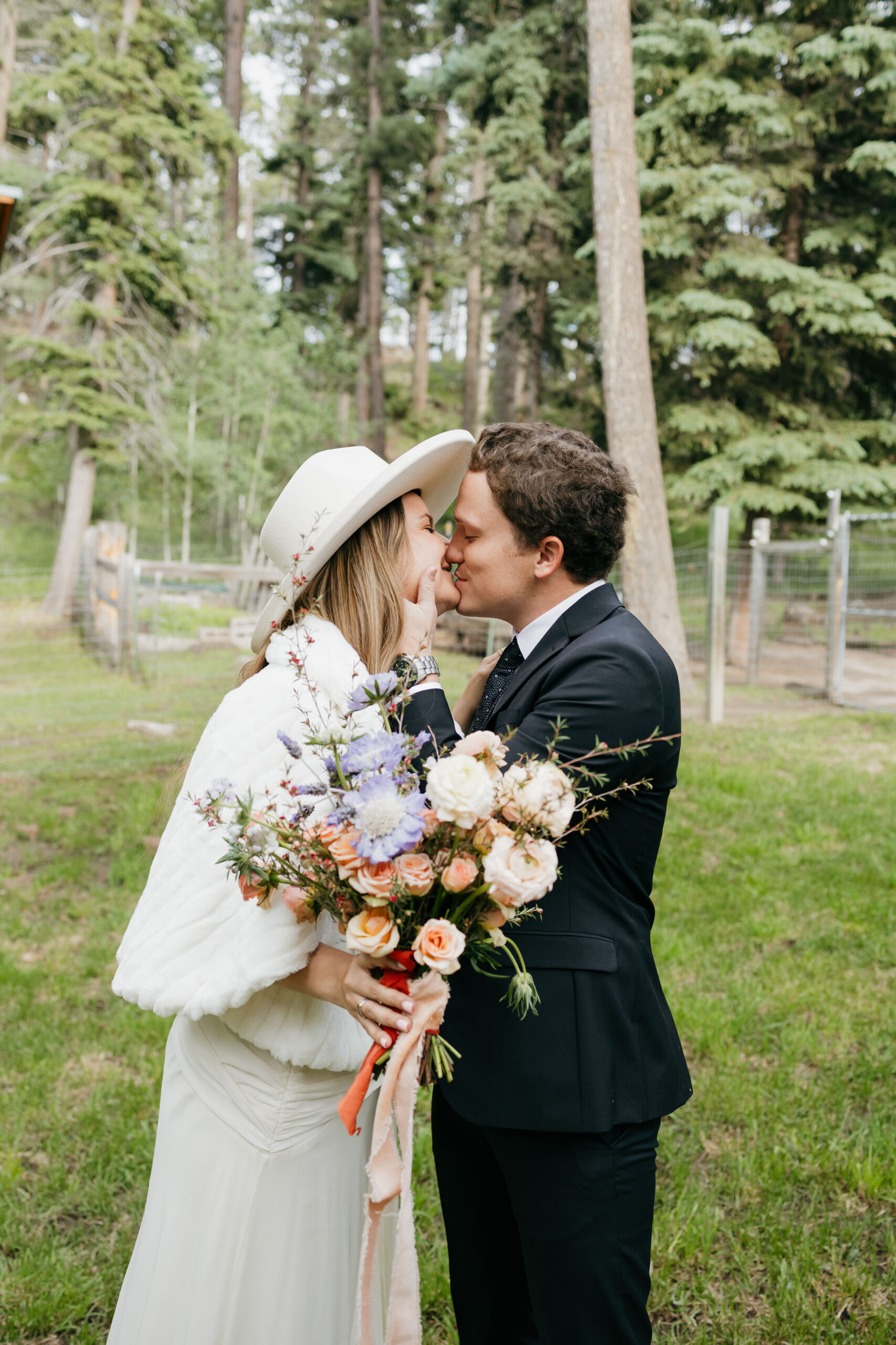 bride and groom pose together in the New Mexico nature