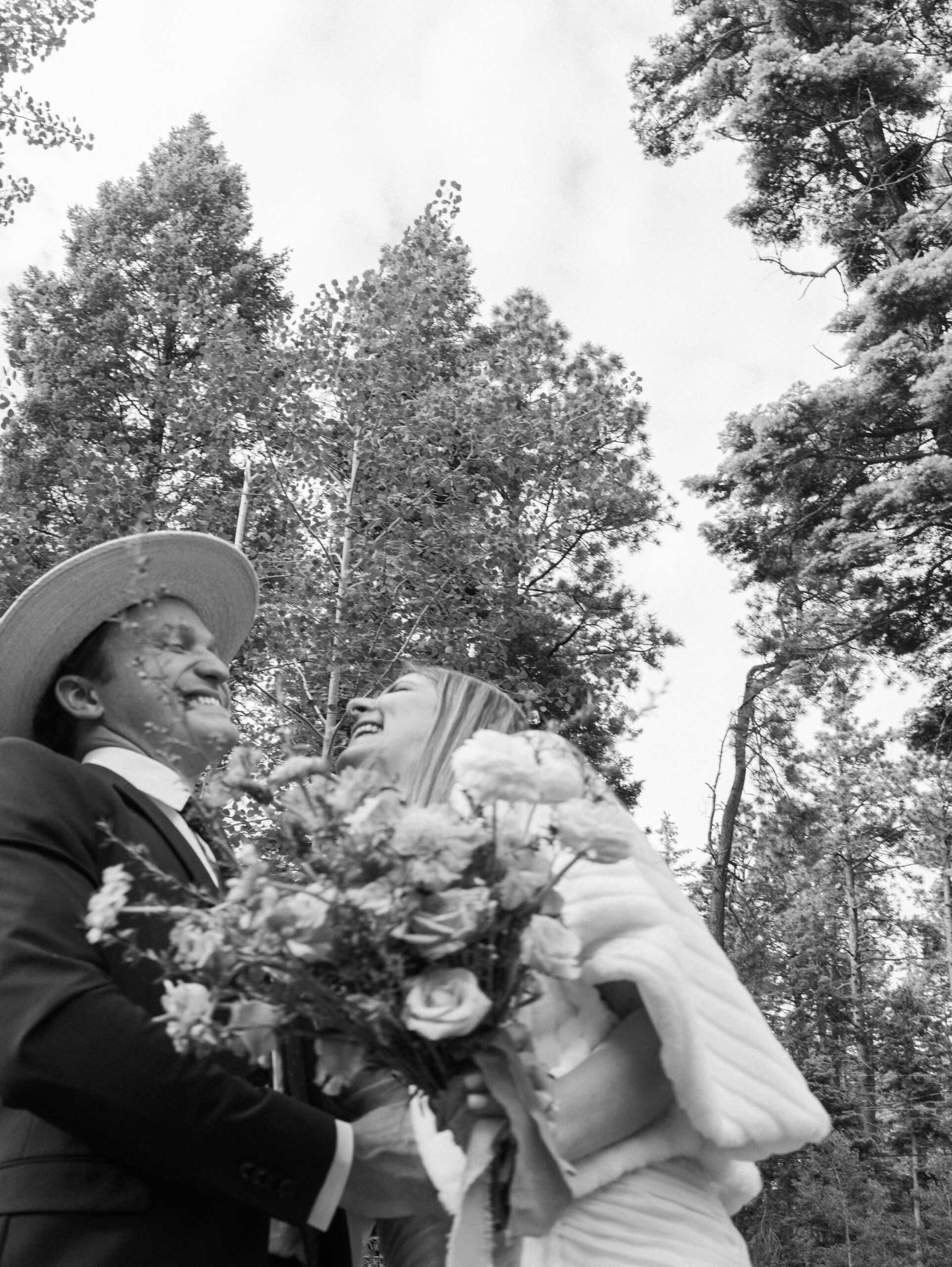 bride and groom pose together in the New Mexico nature