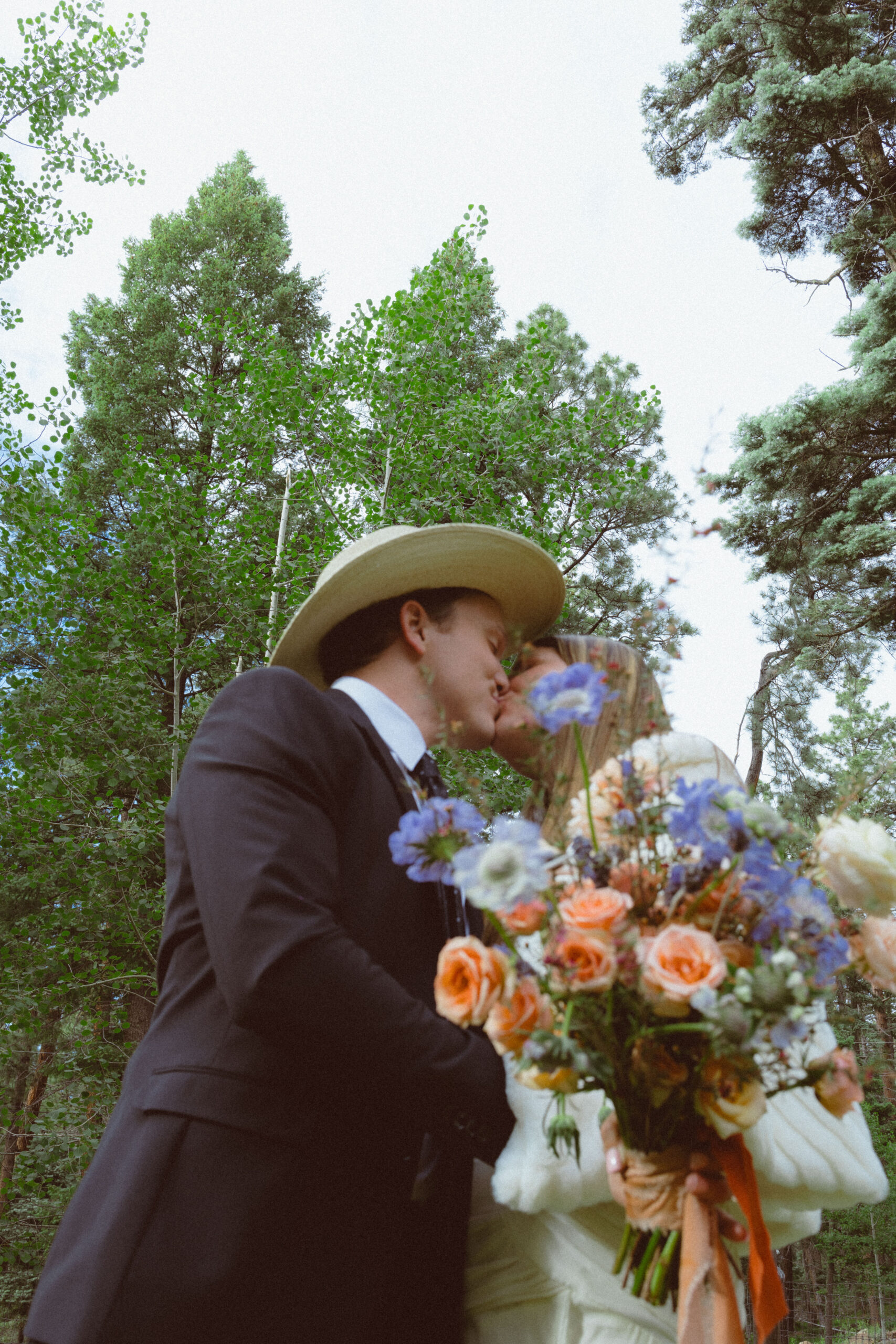 bride and groom pose together in the New Mexico nature