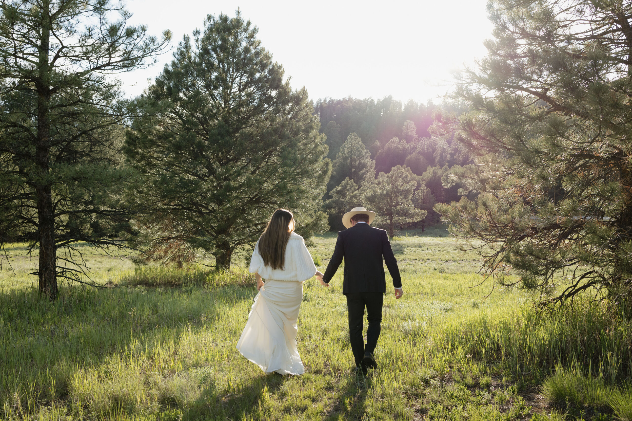 bride and groom pose together in the New Mexico elopement