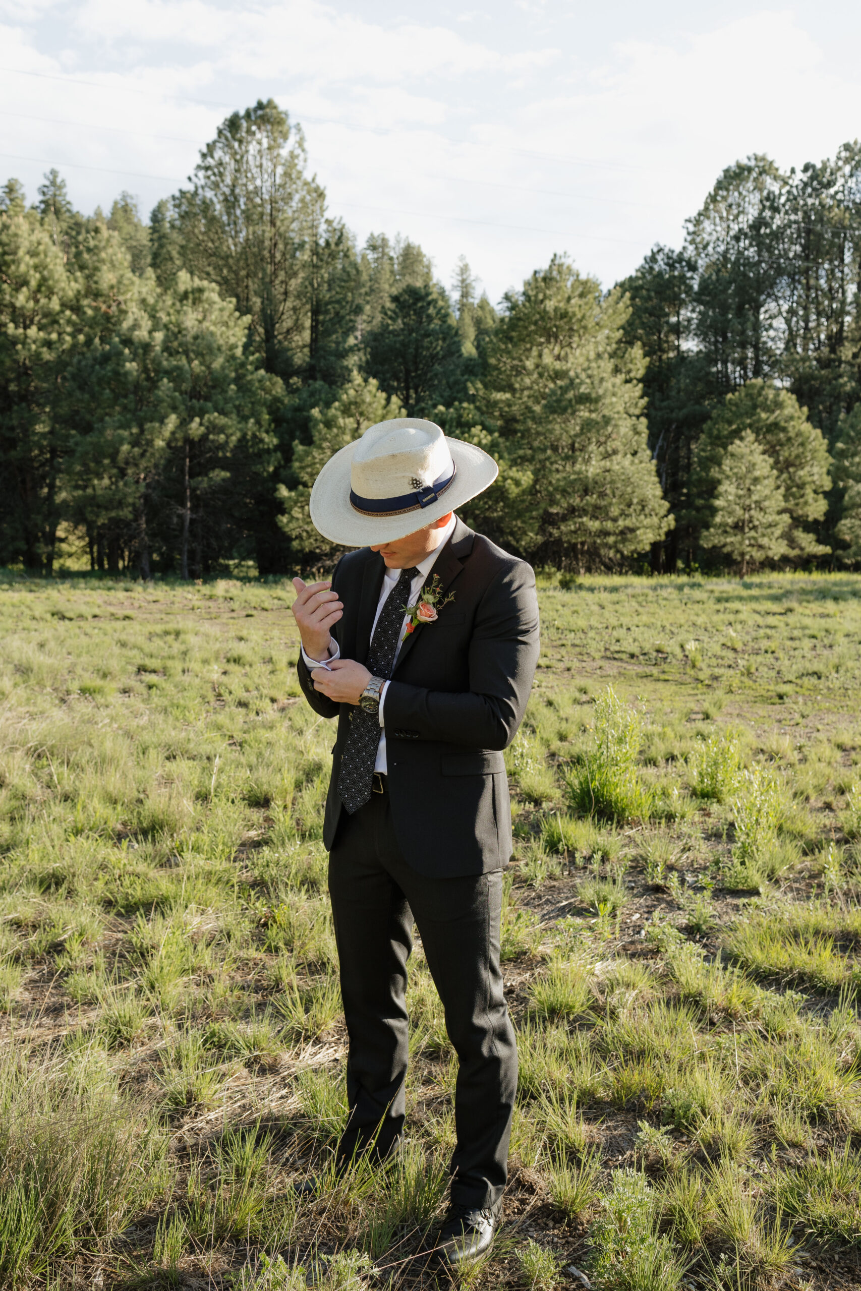 groom poses on his elopement day