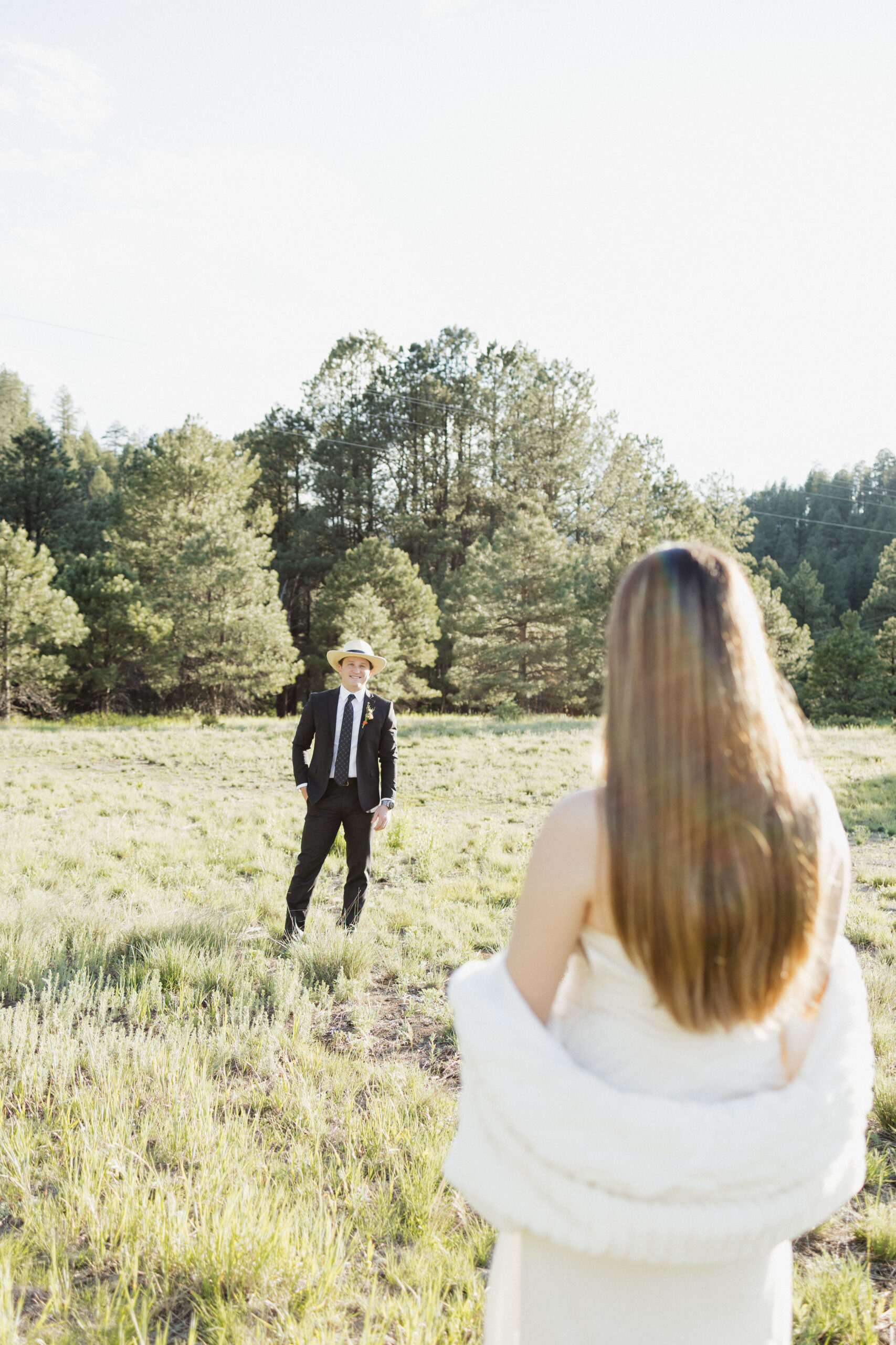 bride and groom pose together in the New Mexico nature