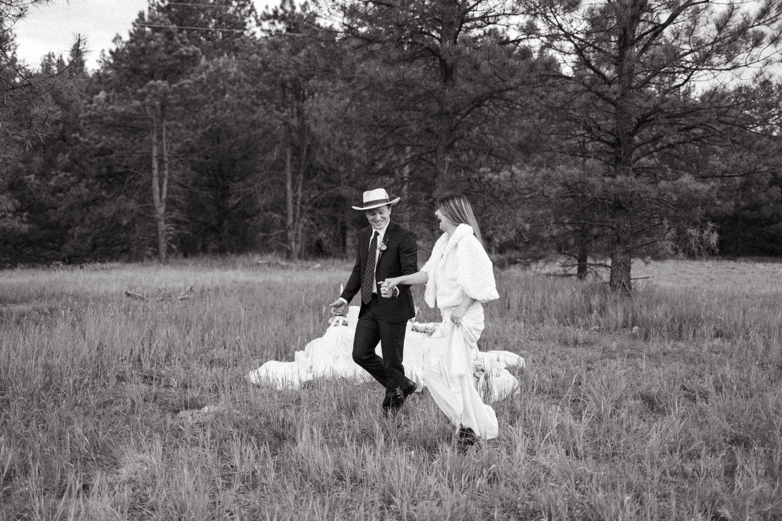 bride and groom pose together in the New Mexico nature