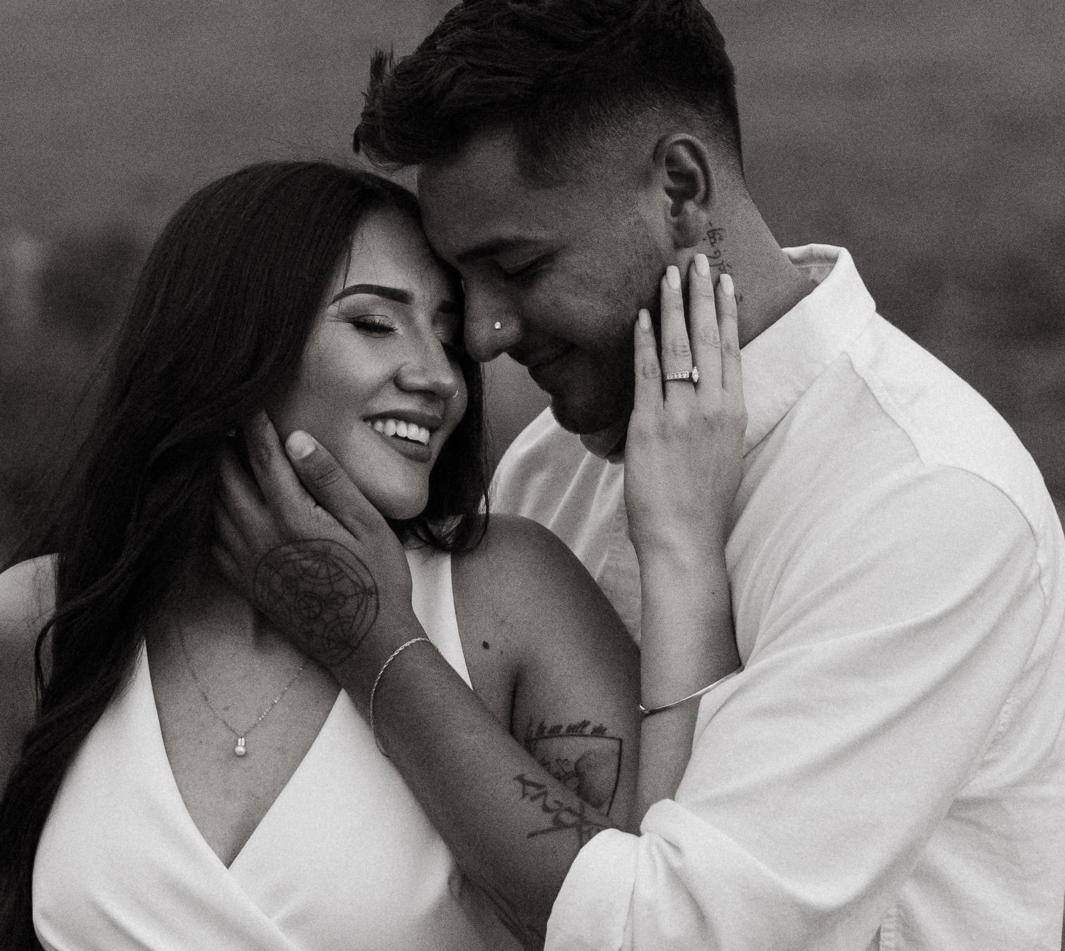 stunning couple pose together during their engagement photos