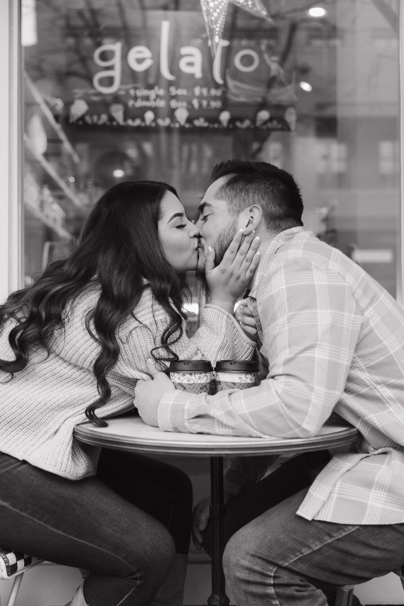 beautiful couple pose together during their winter city engagement photo session