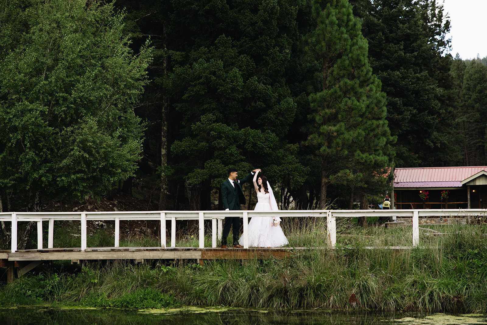 beautiful bride and groom pose for a photo on their wedding day