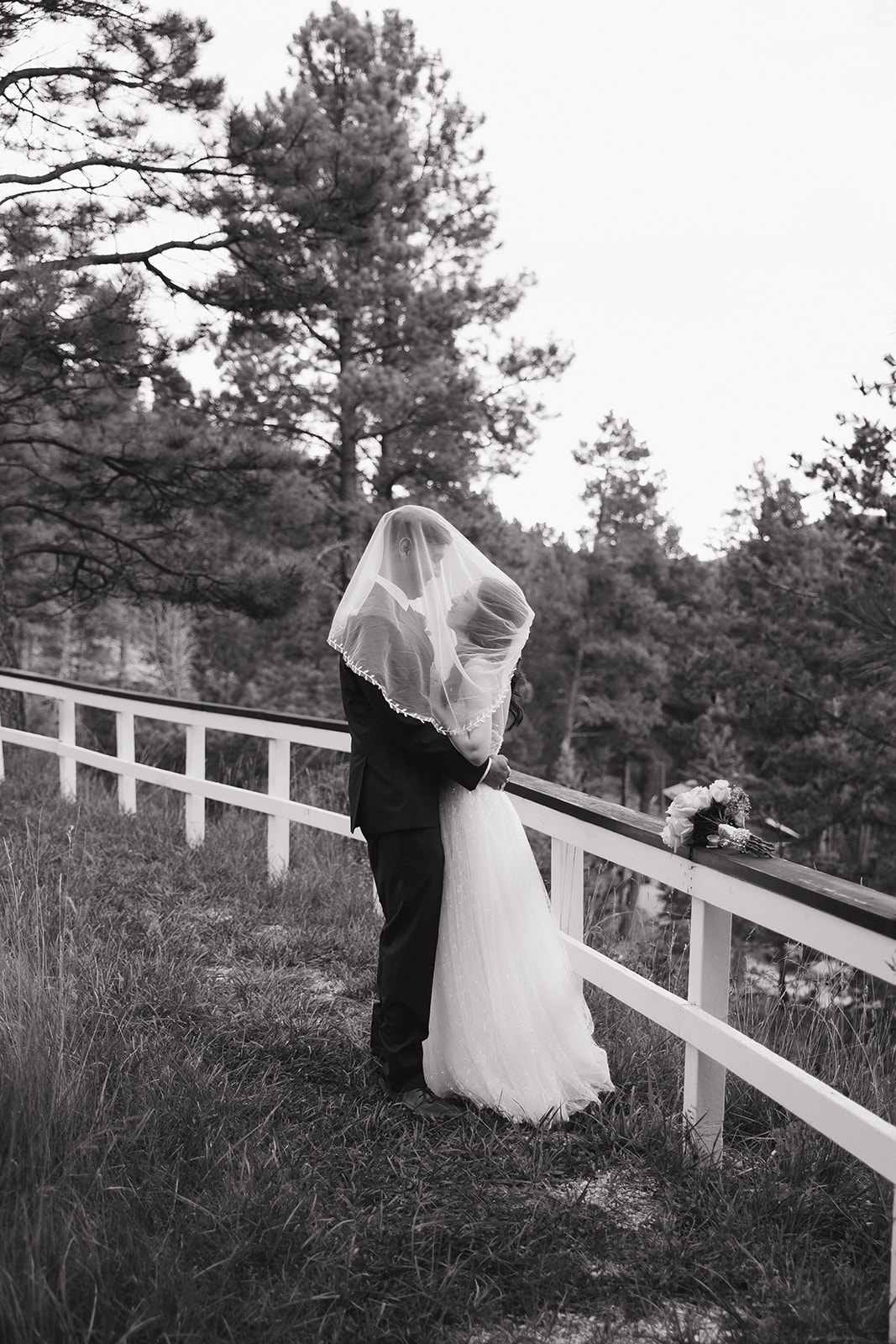 beautiful bride and groom take portraits together 