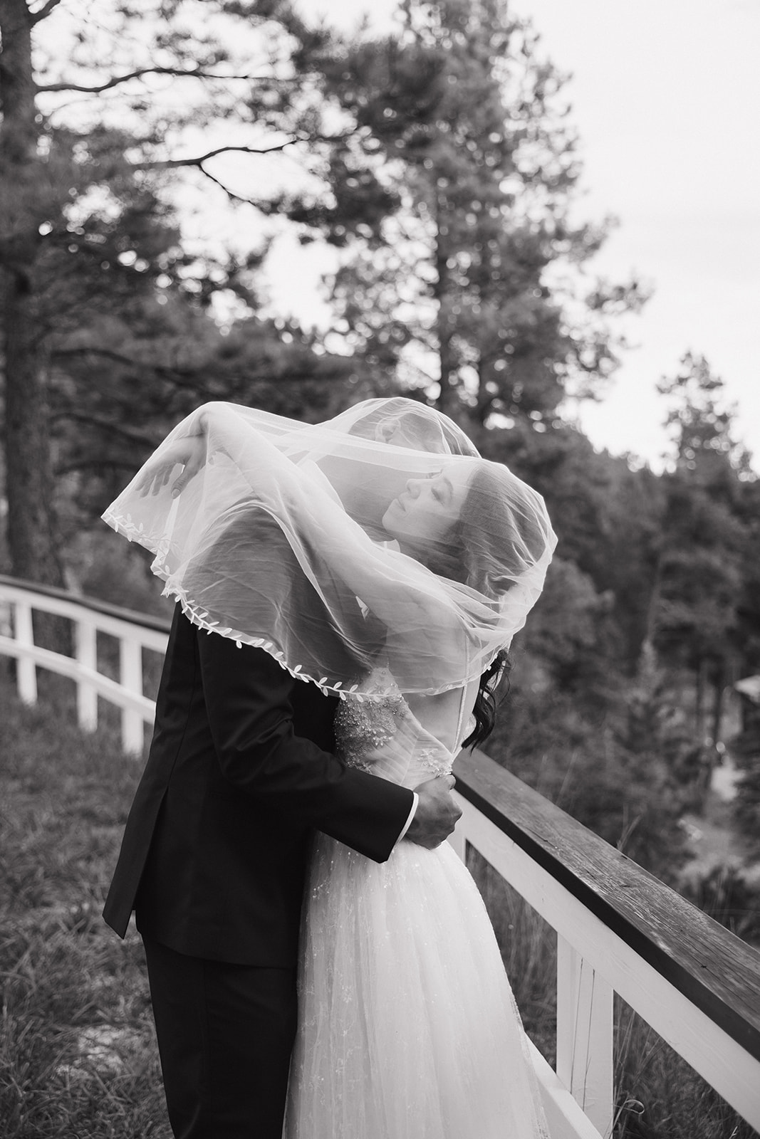 beautiful bride and groom take portraits together 