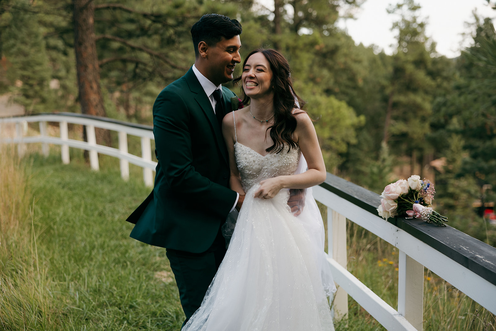 beautiful bride and groom take portraits together 